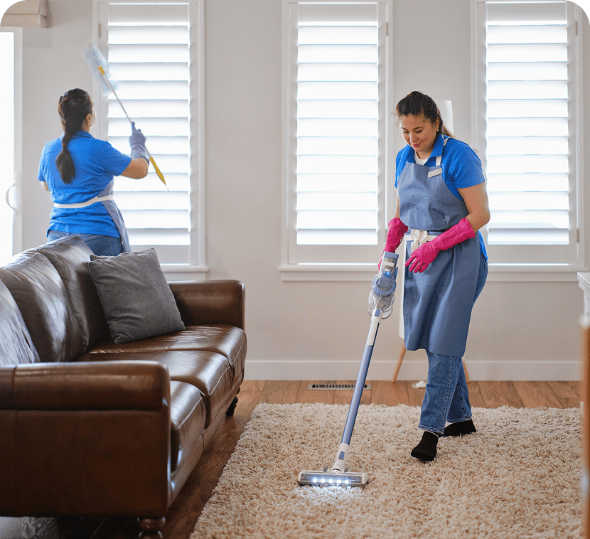 Housekeepers cleaning modern living space