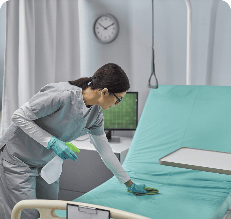 Nurse sanitizing medical equipment