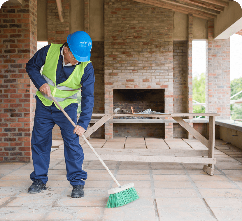 Worker tidying up construction area