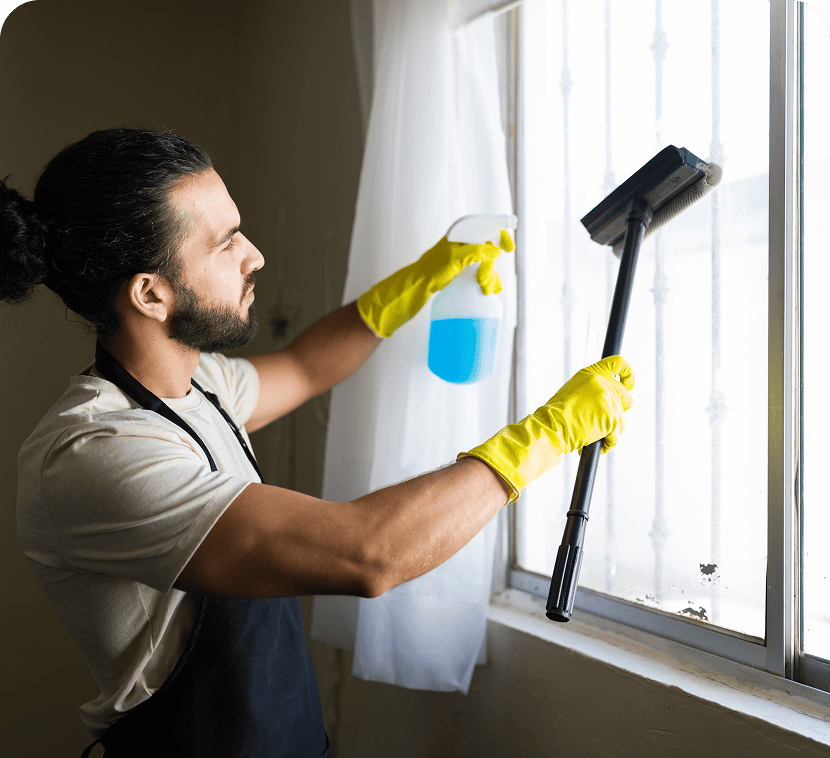 Window cleaning with blue spray bottle