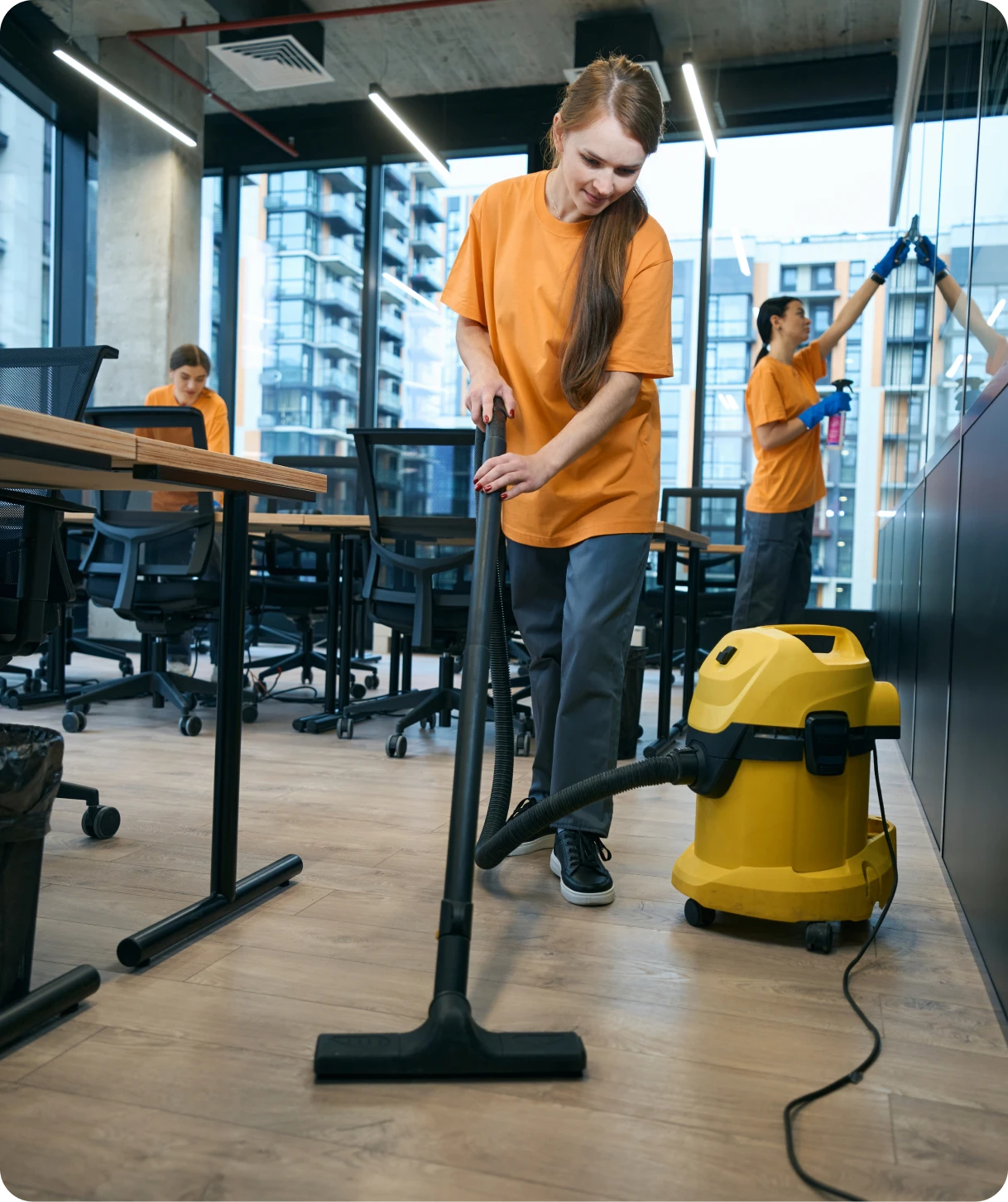 Team cleaning with vacuum and cloths