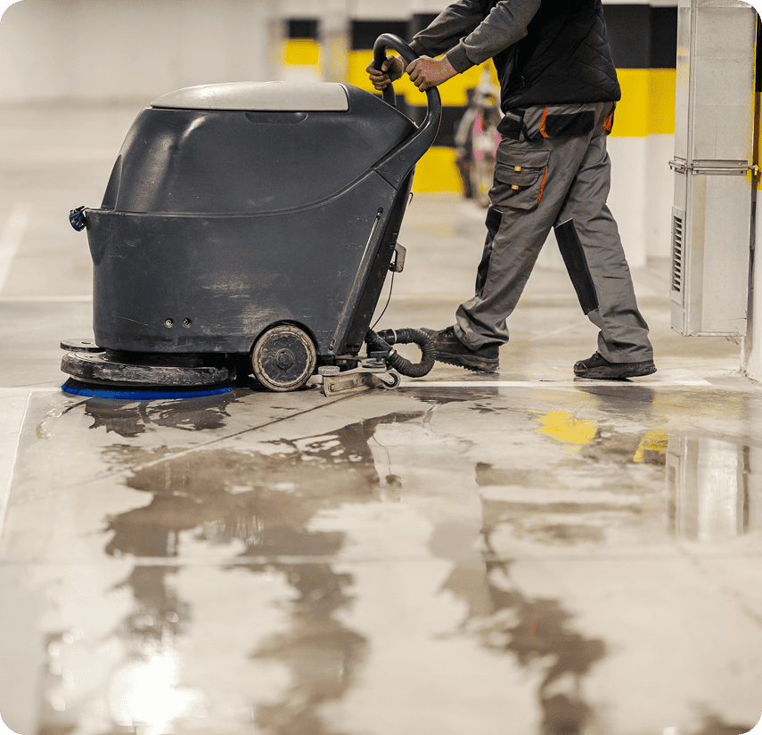 Industrial floor cleaning process underway