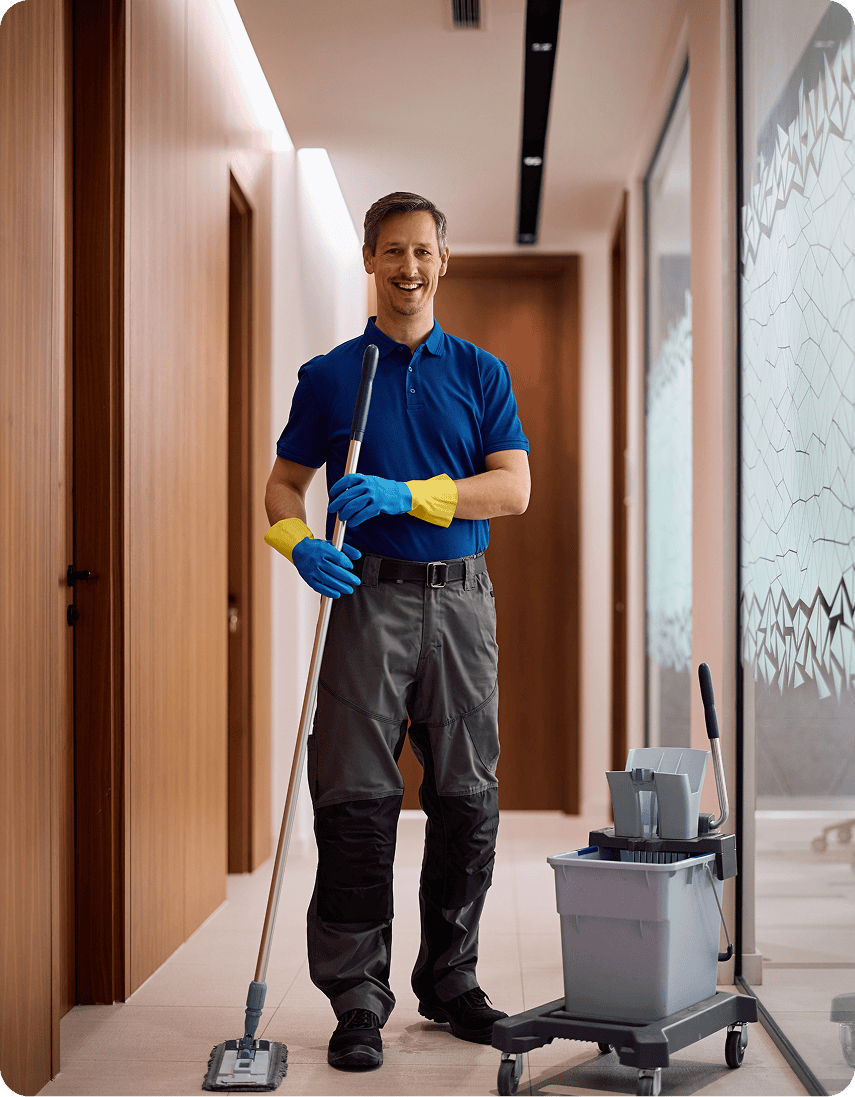 Janitor in blue uniform mopping floor