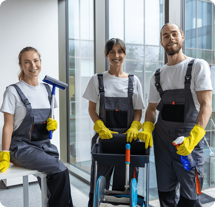 Janitorial staff smiling by window